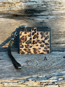 A leopard cowhide keychain wristlet wallet.  A
