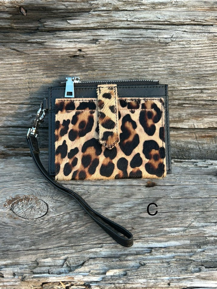 A leopard cowhide keychain wristlet wallet.  C