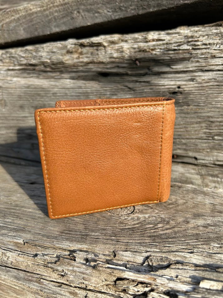 This Brown leather bifold wallet features a cowhide inlay with a Praying Cowboy Concho.  Rear view showing additional slot. 