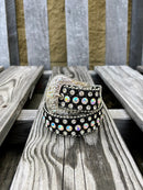 A black leather belt for kids, adorned with rhinestones with a Silver Western style buckle. Close up of buckle. 