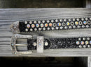 A black leather belt for kids, adorned with rhinestones with a Silver Western style buckle. Belt laid out showing both ends. 