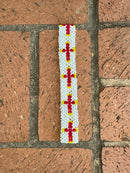 White beaded head or hat band with Red Crosses. 
