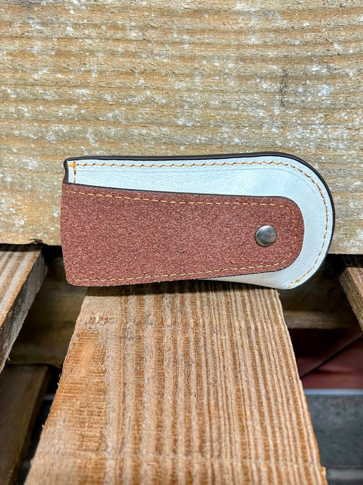Beige tooled leather knife sheath. Rear view showing leather belt loop.