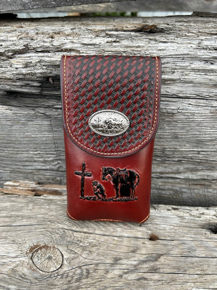 Brown basketweave leather phone case with embossed Praying Cowboy design as well as a Praying Cowboy Concho. Front View