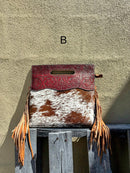 A cowhide and Brown tooled leather purse with fringe. Front View B