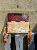 A cowhide and Brown tooled leather purse with fringe. Front View E