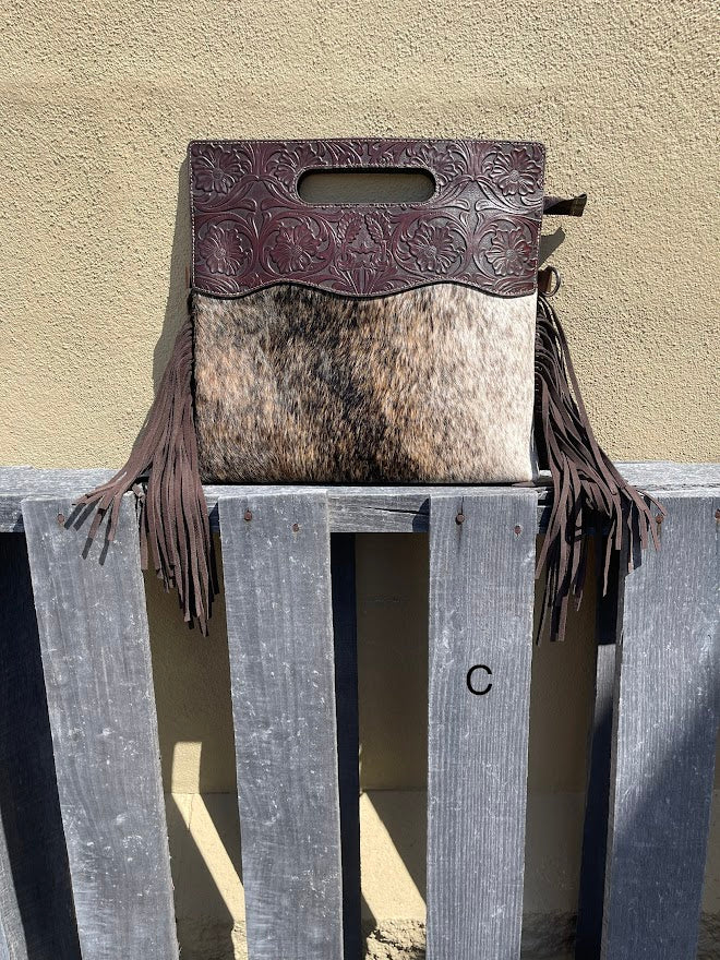 Cowhide and Coffee Brown tooled leather purse with fringe. This bag can be carried by the handle or the removable, adjustable strap. Front View C