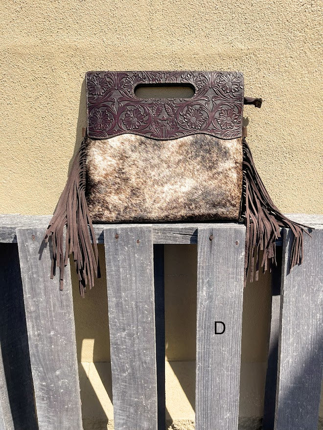 Cowhide and Coffee Brown tooled leather purse with fringe. This bag can be carried by the handle or the removable, adjustable strap. Front View D