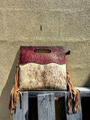 A cowhide and Brown tooled leather purse with fringe. Front View I