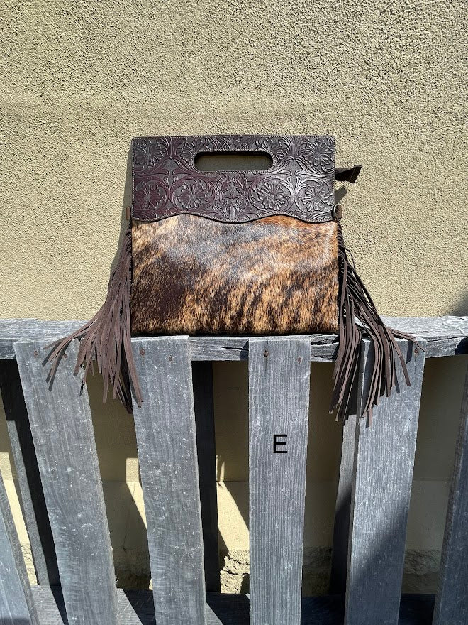 Cowhide and Coffee Brown tooled leather purse with fringe. This bag can be carried by the handle or the removable, adjustable strap. Front View E