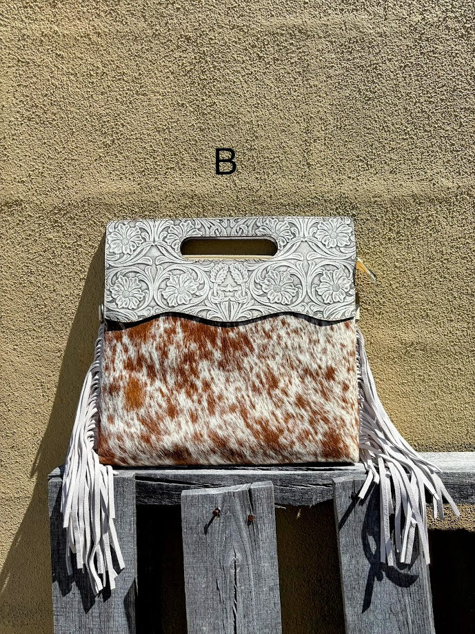 Cowhide and Beige tooled leather purse with fringe. This bag can be carried by handle or removable adjustable strap. Front View B