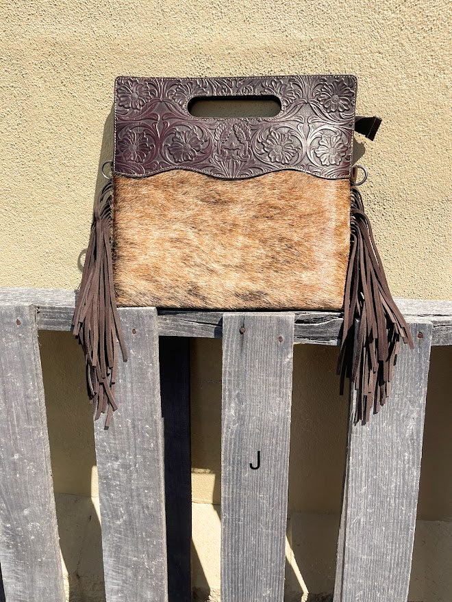 Cowhide and Coffee Brown tooled leather purse with fringe. This bag can be carried by the handle or the removable, adjustable strap. Front View J