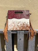 A cowhide and Brown tooled leather purse with fringe. Front View A