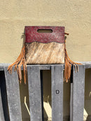 A cowhide and Brown tooled leather purse with fringe. Front View D