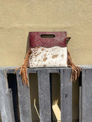 A cowhide and Brown tooled leather purse with fringe. Front View F