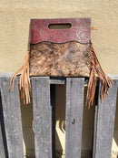 A cowhide and Brown tooled leather purse with fringe. Front View J