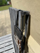  Black tooled leather and cowhide fringe bag. Side view showing purse strap. 