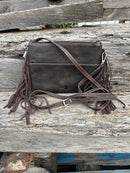 Coffee Brown embossed leather and cowhide crossbody bag with fringe sides. Rear View showing solid leather back with external pocket. 