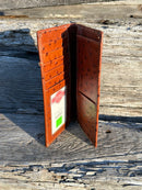 Brown ostrich print leather checkbook wallet with cowhide inlay featuring a Longhorn Concho. Inside view showing multiple card slots, ID window, and checkbook slot. 
