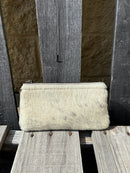 Cowhide wristlet purse in a Coffee Brown solid leather back and a zippered closure. It has a wristlet strap and a removable adjustable shoulder strap. Front View L