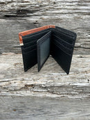Black leather bifold wallet with embossed Brown overlay featuring a Bull Rider Concho. Inside view showing a dual ID window and multiple card slots. 