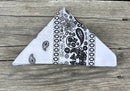 White bandana with a classic black paisley pattern. 