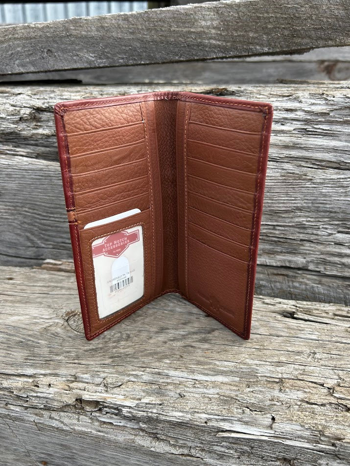 Brown leather tall wallet with embossed Praying Cowboy design on top of a basketweave leather bottom with three cowhide inlay crosses. Inside view showing multiple card slots and a ID window. 