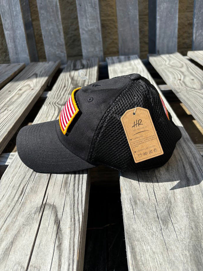 A Back mesh back cap with an American flag patch on the front. Side View