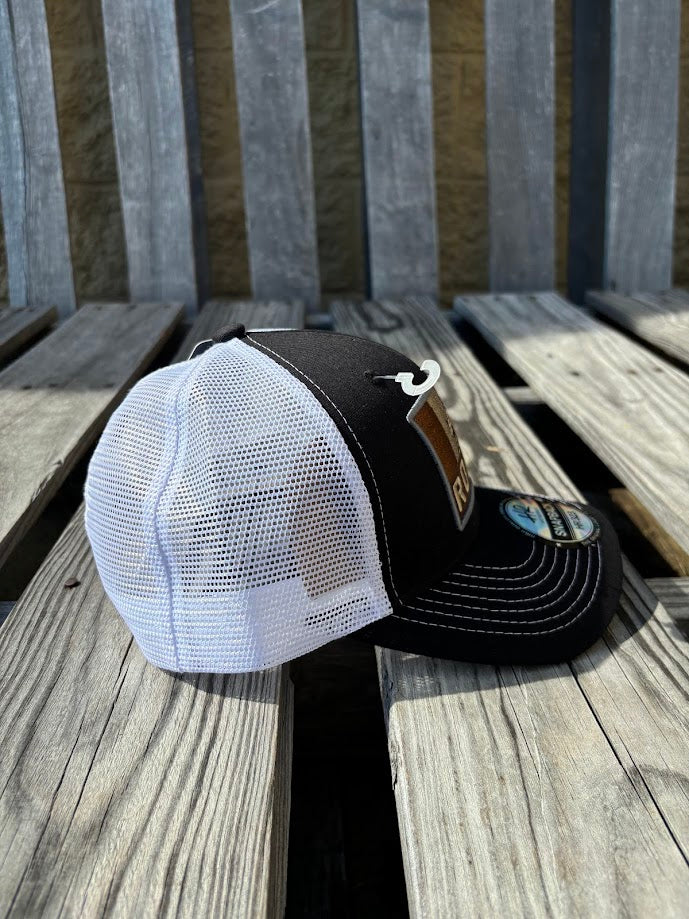 A Black trucker cap with a 
White mesh back featuring a 'RODEO' Bull Rider patch on the front. Side View
