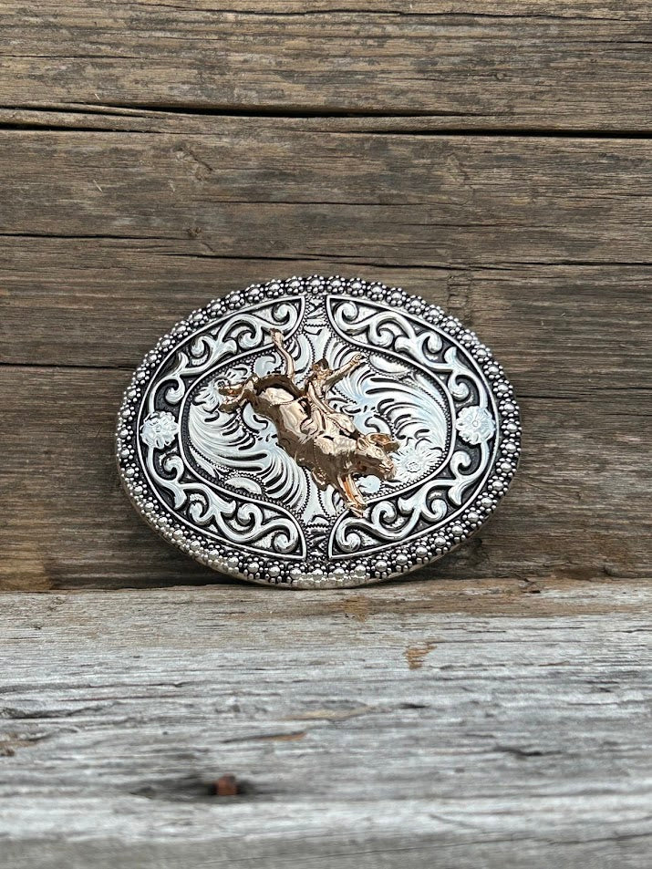 Gold Bull Rider on a Silver oval belt buckle with intricate designs. Front View