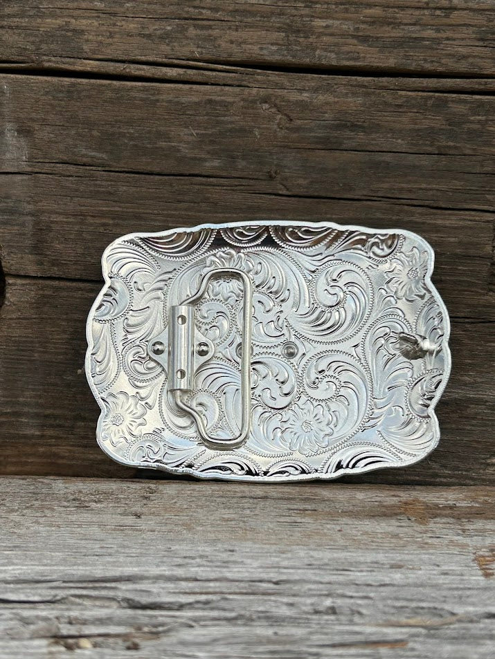 This buckle features a Silver Praying Cowboy design with a intricate Silver border. Rear View