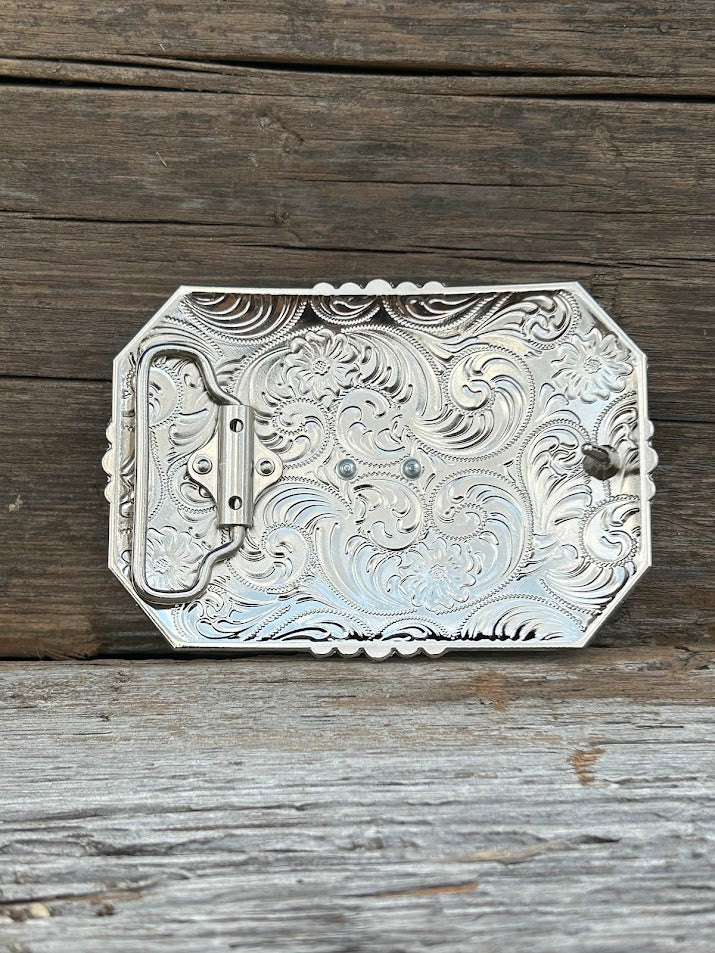 This buckle features a Gold Horse design with a intricate Silver border.  Rear View