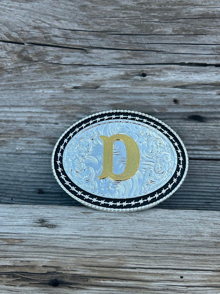 Matte Black and Silver oval shaped belt buckle with Gold initial. Initial D