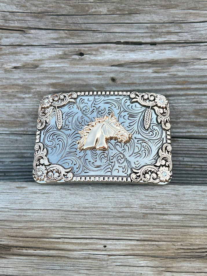 This buckle features a Gold Horse design on a Silver background. Front View 
