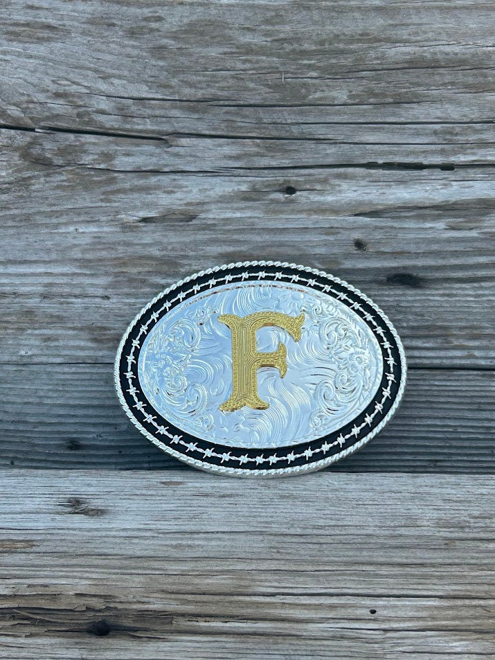 Matte Black and Silver oval shaped belt buckle with Gold initial. Initial F