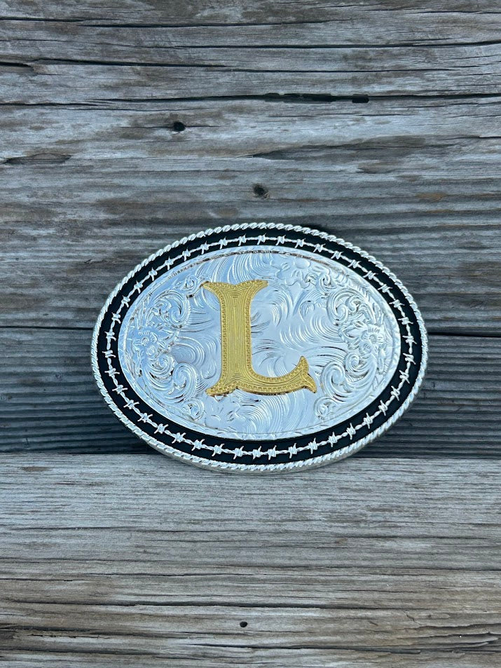 Matte Black and Silver oval shaped belt buckle with Gold initial. Initial L