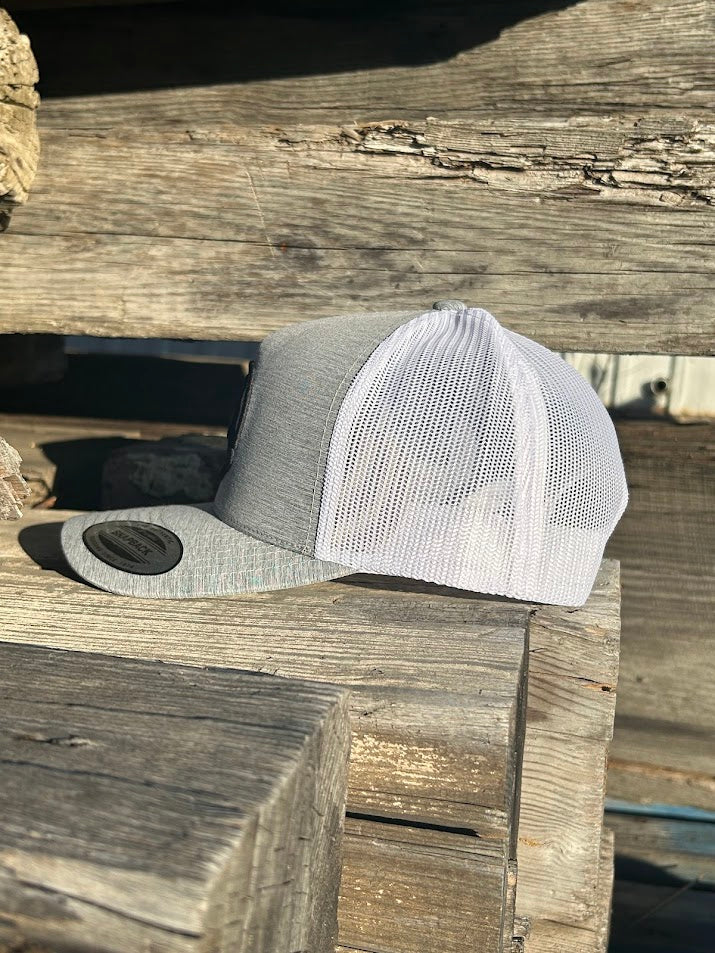 Hooey grey snapback trucker cap with a white mesh back and a black Roughy logo on the front. Side View 