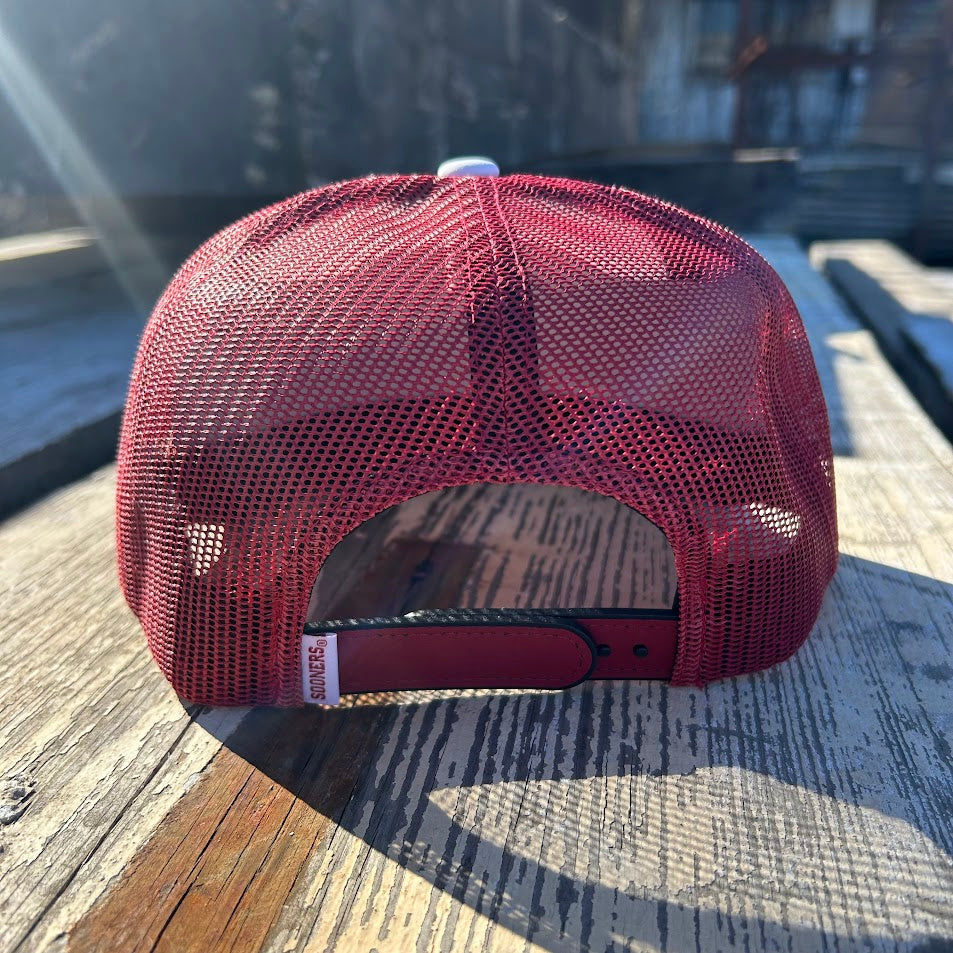 Red and white snapback cap with Oklahoma state outline and OU logo patch. Rear View 