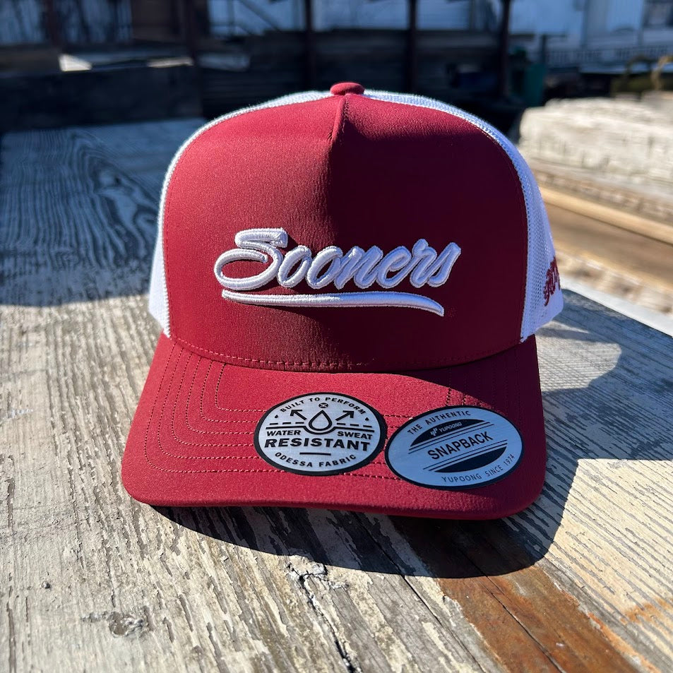 Crimson and white Snapback cap with Sooners embroidered on front with a white mesh back and Hooey logo embroidered on side. Front view 