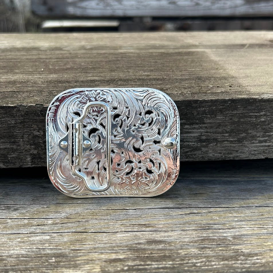 Small Silver belt buckle with rhinestones and intricate scrollwork. Rear View