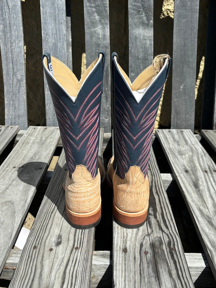 A pair of men's Anderson Bean cowboy boots with tan washed shoulder and a 12" navy upper. Rear View