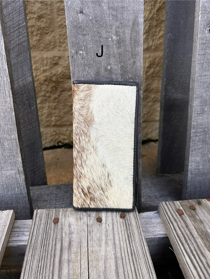 This cowhide leather tall wallet from Top Notch Accessories features 12 card slots and two bill pockets. Front View J