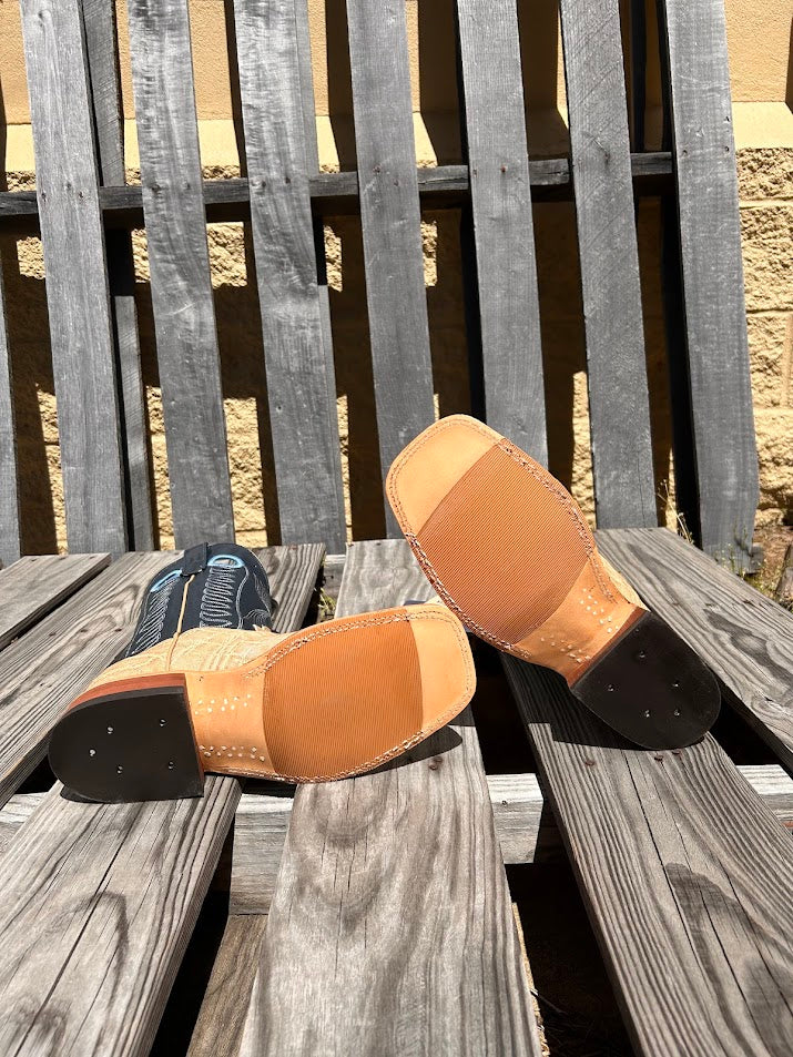 Men's Anderson Bean square toe cowboy boots in Umber Bruciato Elephant skin and a 12" Regal Blue Kidskin tops. Bottom view showing the tan hybrid outsole. 