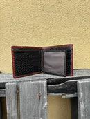 A brown bifold wallet featuring a embossed buck design with brown inlay. Inside view showing multiple card slots and dual ID window. 