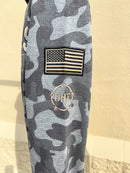 Colosseum Athletics University of Alabama hoodie in Pavement/Heather Camo. This hoodie support the Operation Hat Trick foundation and has patches on the sleeves and near the front pouch pocket. Sleeve details showing American Flag patch and OTH embroidery detailing. 