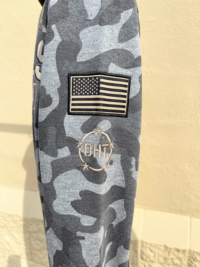 Colosseum Athletics Slate Heather Camo University of Mississippi crewneck sweatshirt with a Rebels Hotty Toddy Ole Miss applique embroidery. Close up of sleeve showing American Flag patch and OTH embroidery. 