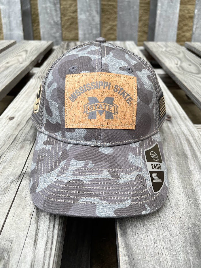Colosseum Athletics Heather Camo snapback cap with a Mississippi State University logo cork patch on the front. Front View