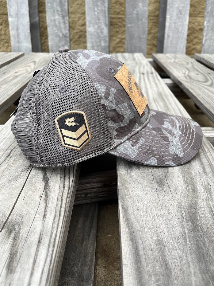 Colosseum Athletics Heather Camo snapback cap with a Mississippi State University logo cork patch on the front. Side view