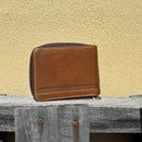 This Brown bifold leather wallet features a zipper closure. Rear View