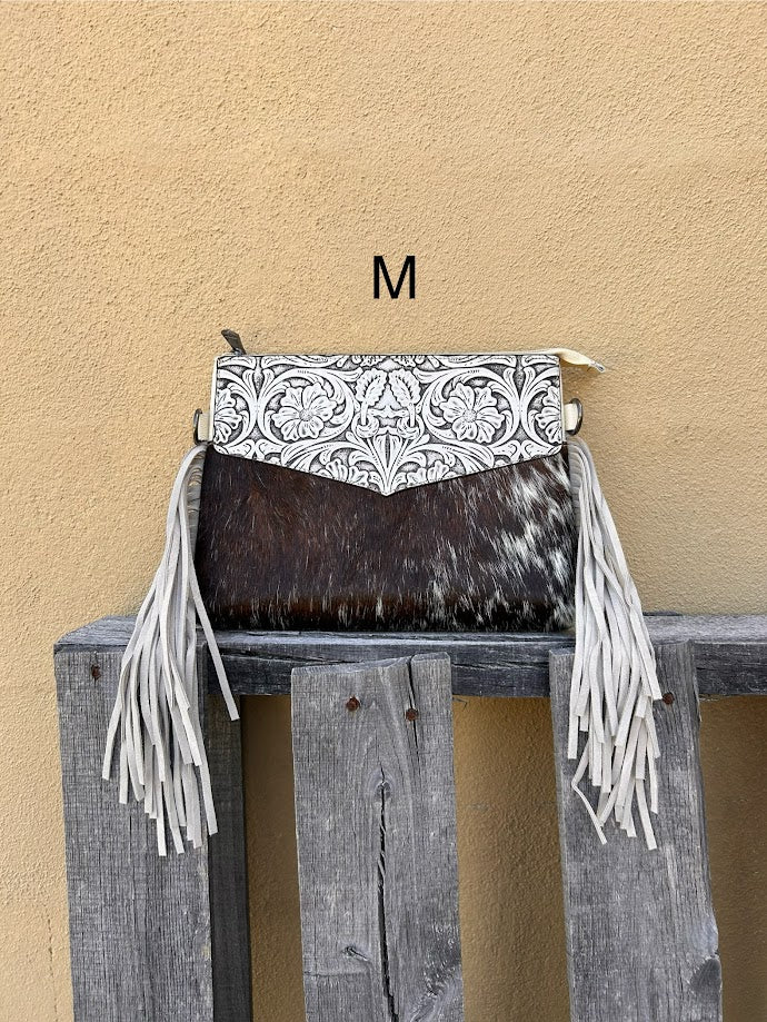 Beige tooled leather and cowhide purse with fringe details and a zippered closure. Front View M